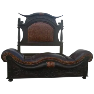 Front view of giant texas bed with longhorn carving and brown leather headboard