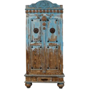 Front view of armoire Santa Marfa featuring copper conchos and carved decorative panels