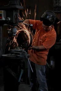 Reata Ranch Interiors 4 Blacksmith heating metal for ironwork