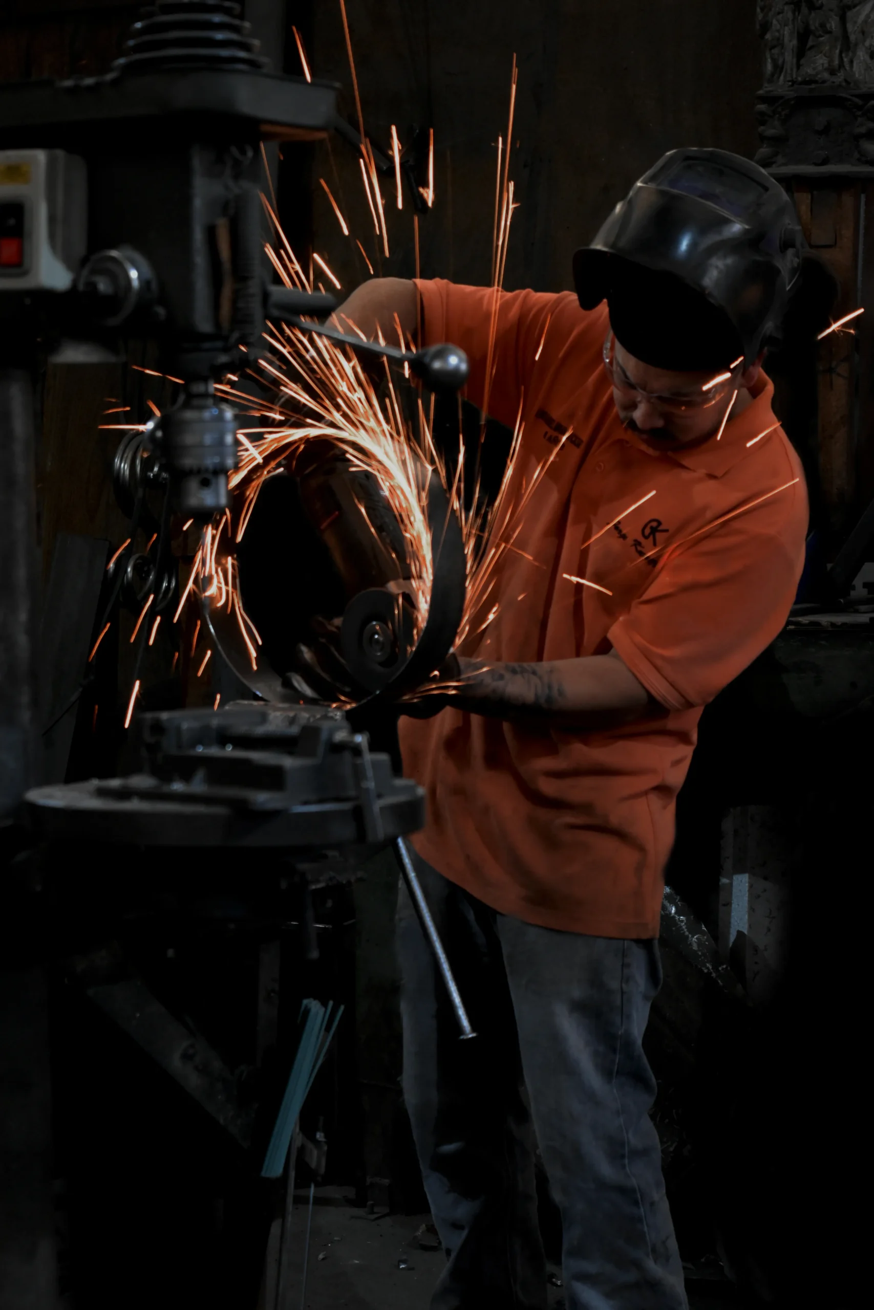 Blacksmith heating metal for ironwork