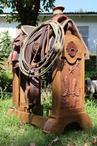 Handmade western saddle stand with custom carved details